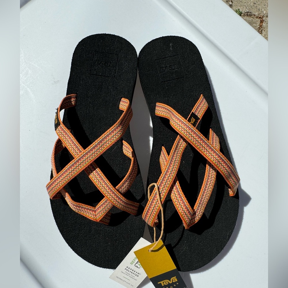 Teva Orange and Black Sandals size 7
New